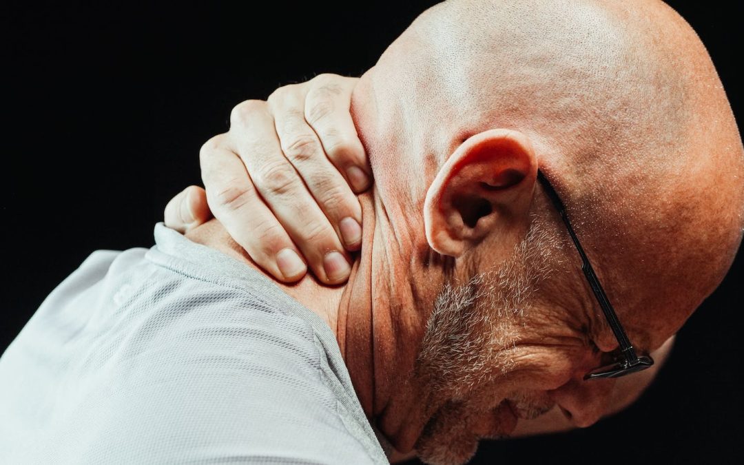 Close-Up Photo of a Man Having a Neck Pain