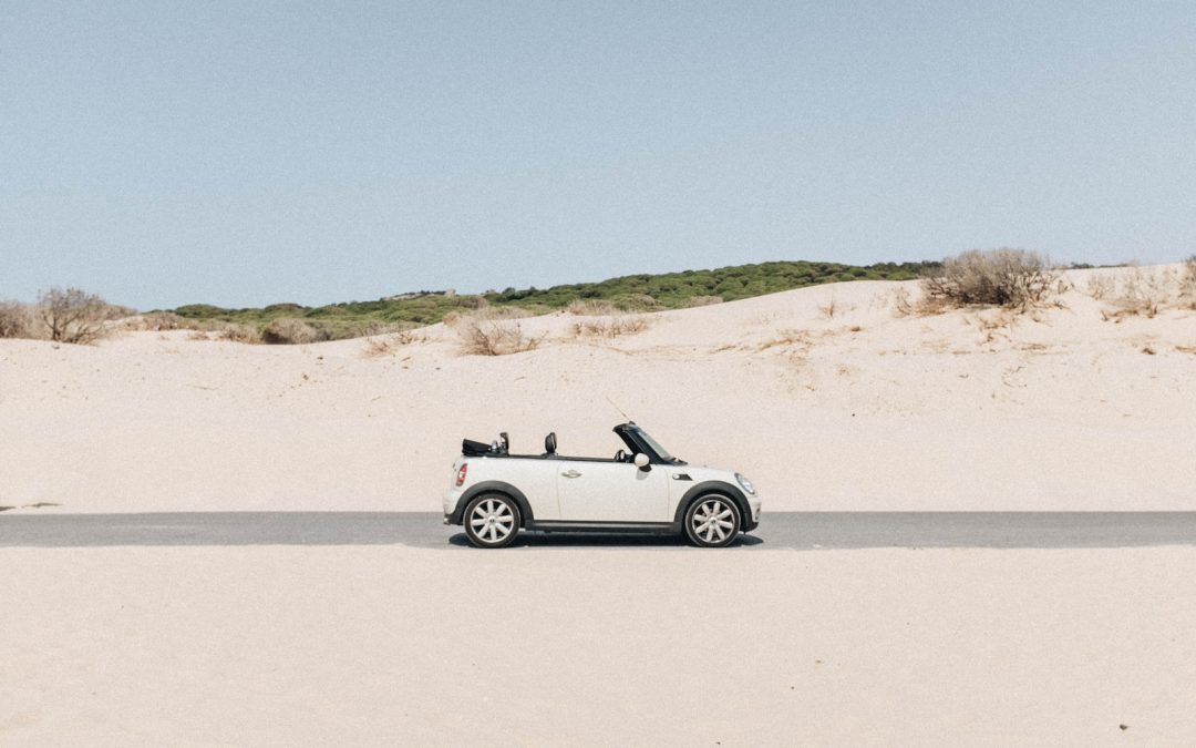convertible coupe in middle of road