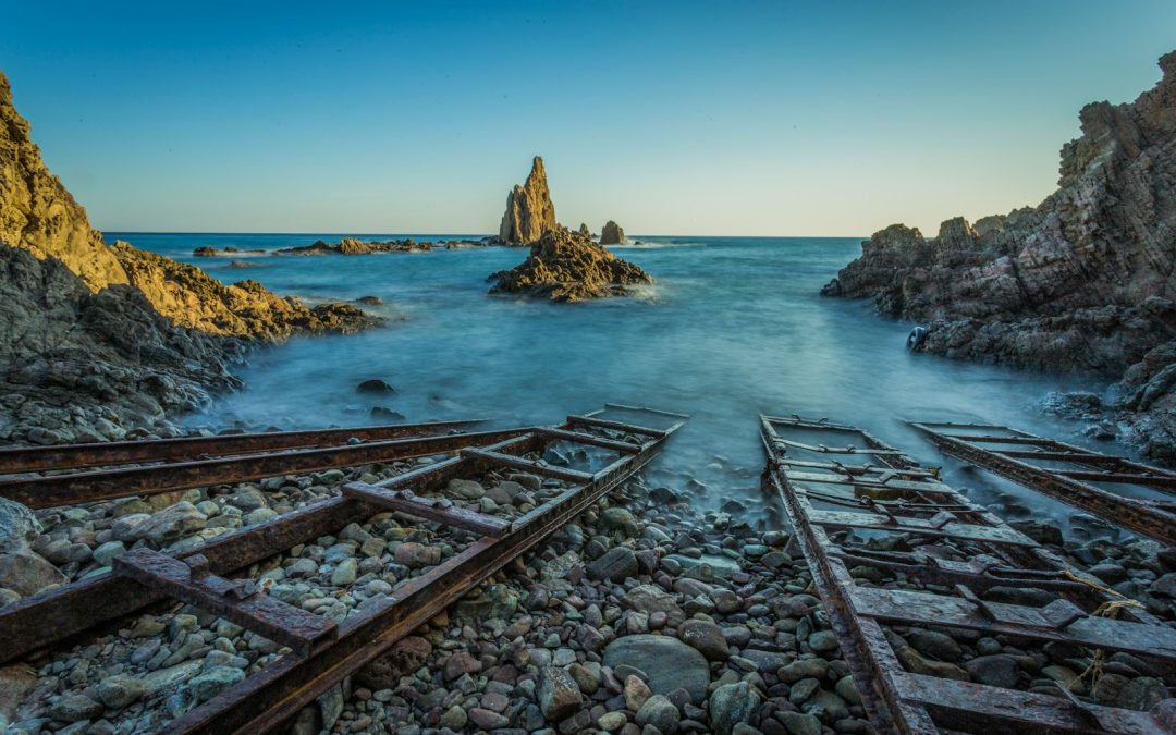 four brown wooden ladders on beach